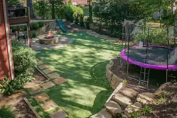 Outdoor makeover: Kid-Friendly-Backyards-Designated-Area-For-Trampoline